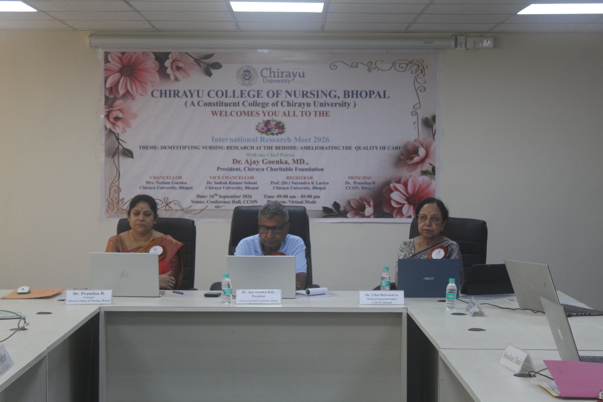 Head table beneath the conference banner